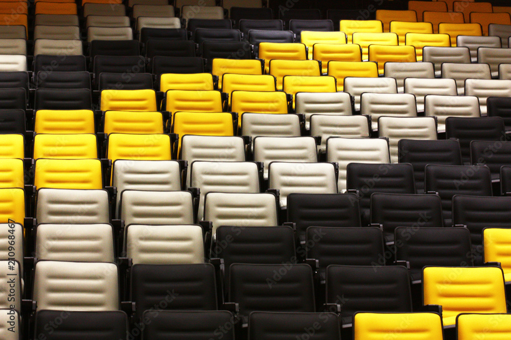 Fototapeta premium line of color chairs in auditorium