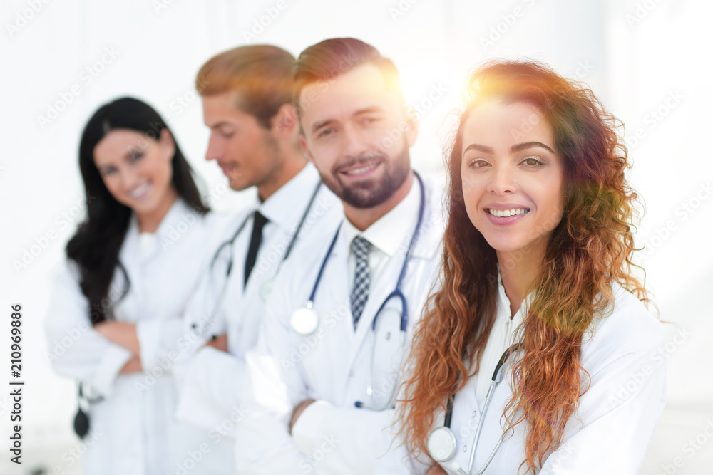 portrait of female doctors with colleagues portrait of female doctors with colleagues