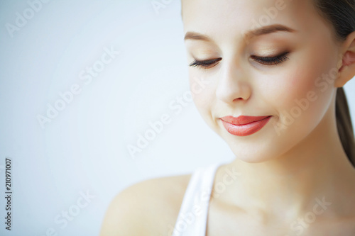 Beauty and Care. Portrait of a Young Woman with a Beautiful Skin. Woman with Beautiful Blue Eyes. Cosmetics. Skin Care