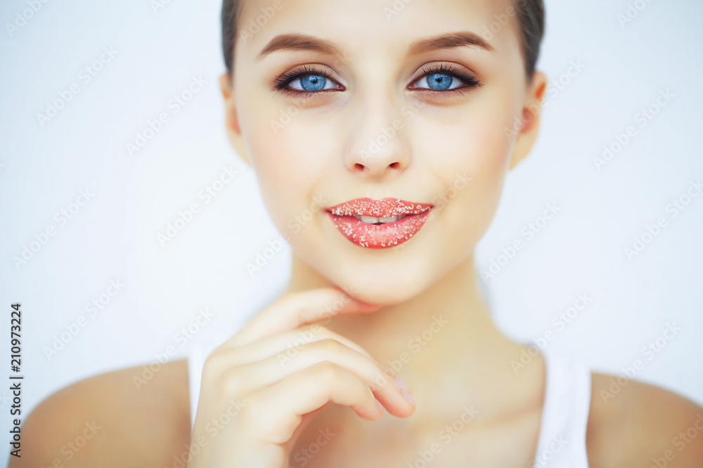 Beauty and Care. Portrait of a Young Woman with a Beautiful Skin. Beautiful Lips. Girl Takes Care of Lips. Woman with Beautiful Blue Eyes. Makeup. Lip Scrub. Peeling Beauty and Care. Portrait of a Young Woman with a Beautiful Skin. Beautiful Lips. Girl Takes Care of Lips. Woman with Beautiful Blue Eyes. Makeup. Lip Scrub. Peeling