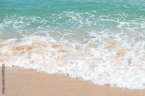 HDR shot of sea shore with wave and white sand during summer day in thailand  selective focus and white balance   color tone shift  