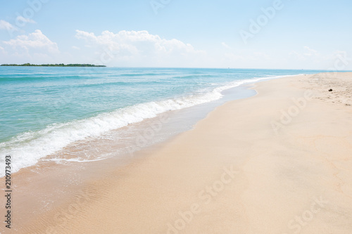 HDR shot of sea shore with wave and white sand during summer day in thailand  selective focus and white balance   color tone shift  