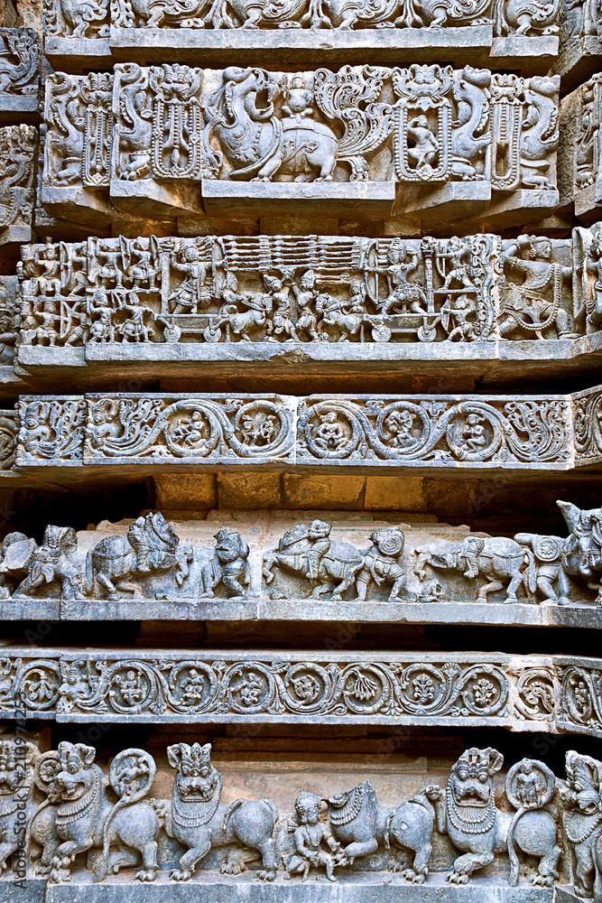 Friezes of animals, scenes from mythological episodes from Ramayana and Mahabharata, at the base of temple, Hoysaleshwara temple, Halebidu, Karnataka