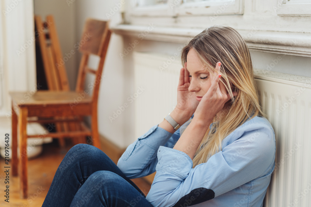 Pretty young woman suffering from a headache Pretty young woman suffering from a headache