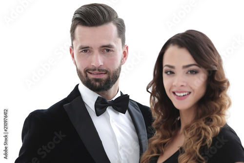 Portrait of a handsome man looking at the camera with a woman