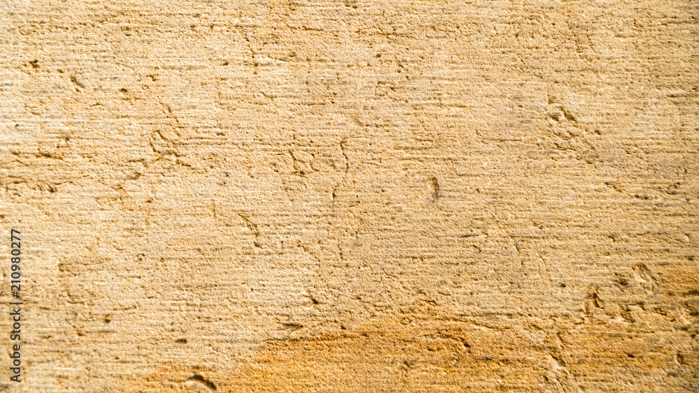 Fototapeta premium Background of old yellow stone texture.