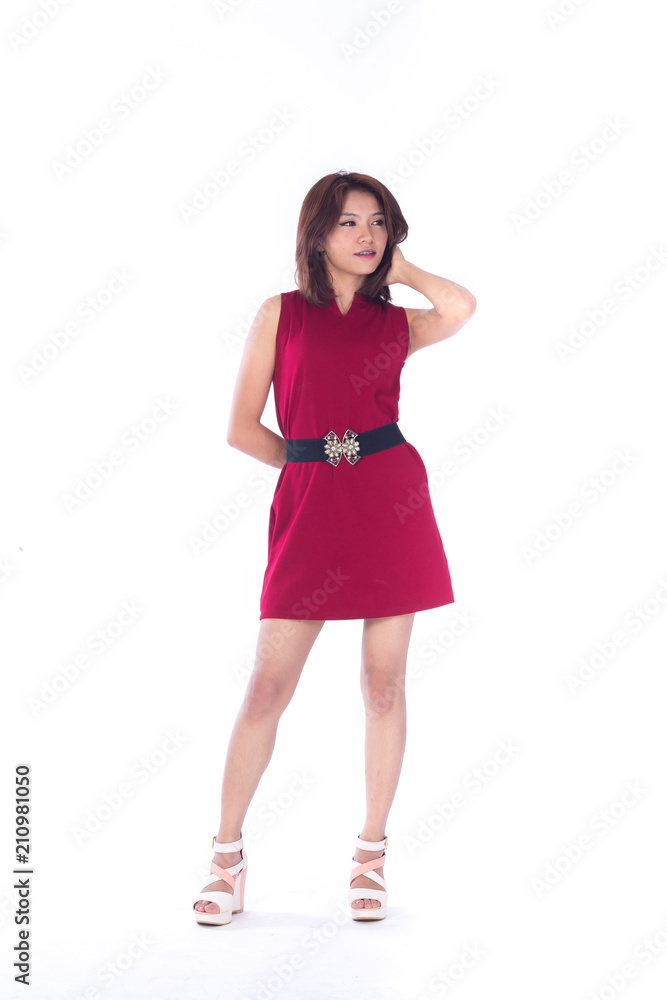 beautiful asian girl in red dress in a studio shot on white background (with selective focus) beautiful asian girl in red dress in a studio shot on white background (with selective focus)