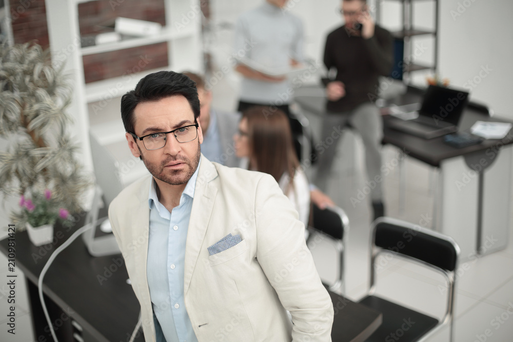 confident businessman on the background of the office confident businessman on the background of the office