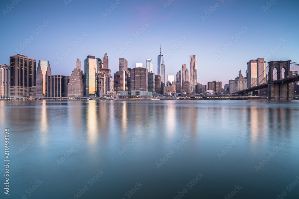 Downtown manhattan with brooklyn bridge view during sunrise Downtown manhattan with brooklyn bridge view during sunrise