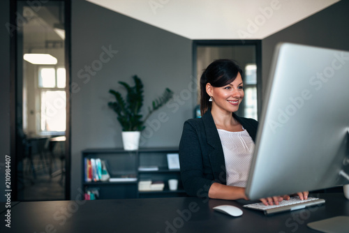 Entrepreneur working on computer at office.