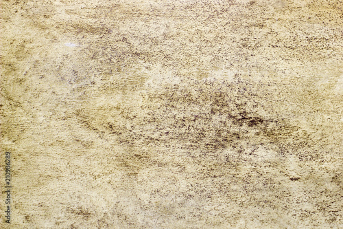 Abstract texture of decorative plaster. Grunge background of stucco texture. Brown grained surface.