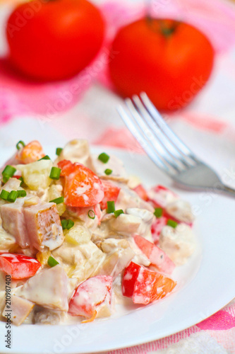 Salad with ham, tomato and mayonnaise