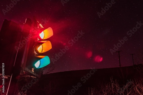 Traffic light in the night with stars long exposure