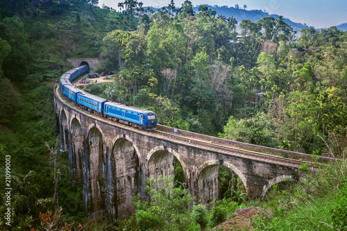 Train on Nine arch Bridge in Sri Lanka. Beautiful train track in hill country. Old bridge in Ceylon.