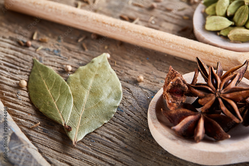 Colourful aromatic various spices for cooking on old wooden board, close-up, flat lay, selective focus. Colourful aromatic various spices for cooking on old wooden board, close-up, flat lay, selective focus.