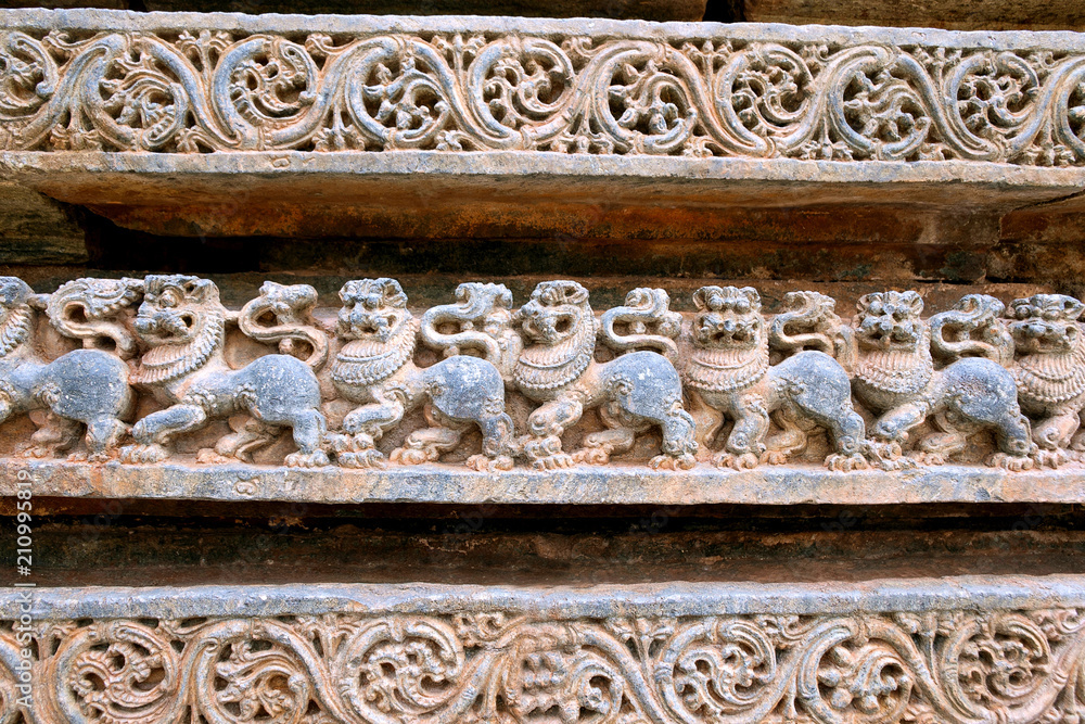 Friezes of Lions at the base of temple, Kedareshwara temple, Halebidu, Karnataka. Lion is the symbol of Hoysla Dinesty.