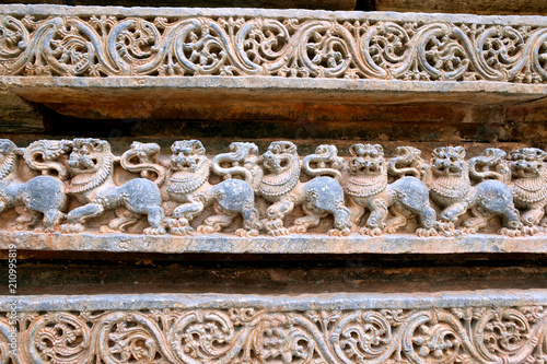 Friezes of Lions at the base of temple, Kedareshwara temple, Halebidu, Karnataka. Lion is the symbol of Hoysla Dinesty.