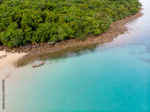 Top view or aerial view of long tail boat on Beautiful crystal clear water in summer of tropical island named Koh kood in Trad, Thailand.