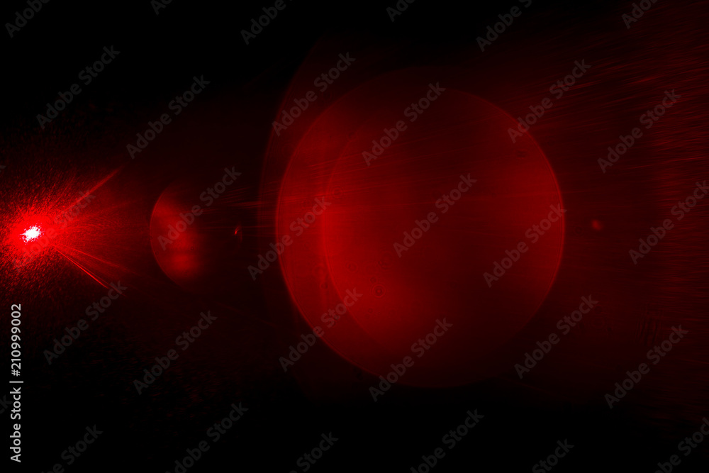 Camera lens flare by laser light create circles of objective and