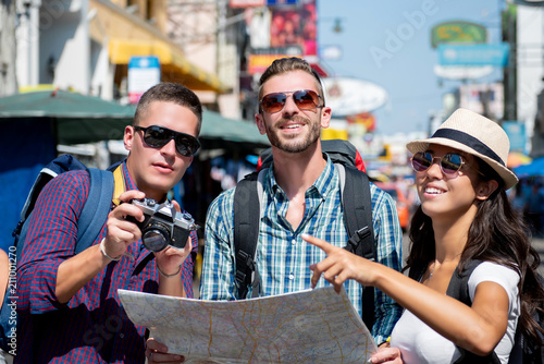 Group of tourist backpacker friends traveling in Khao San road Bangkok Thailand on summer vacations
