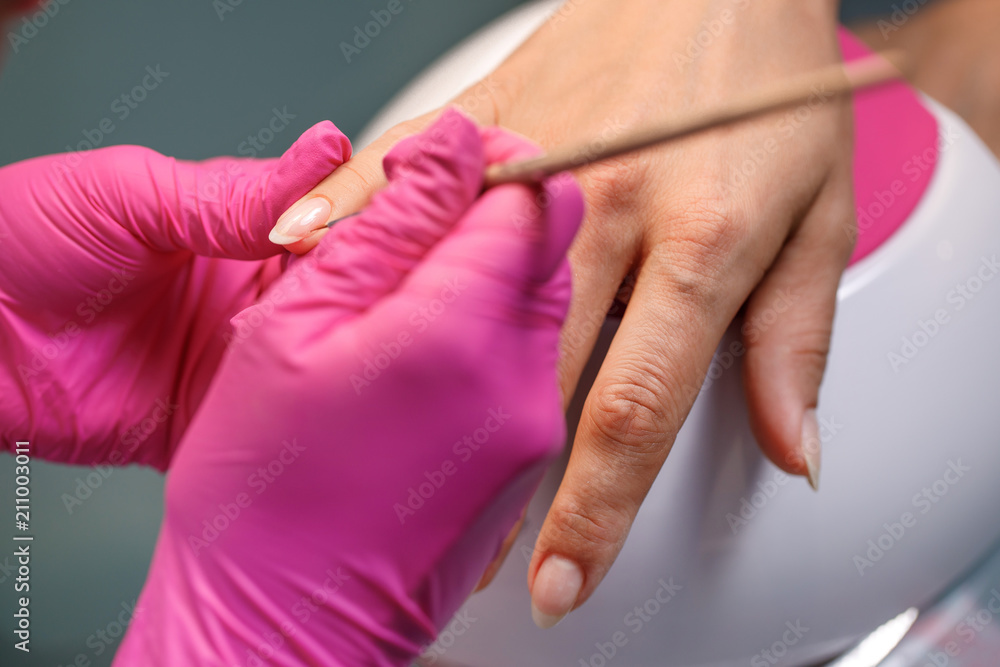 beautician applying Polish nails beautician applying Polish nails