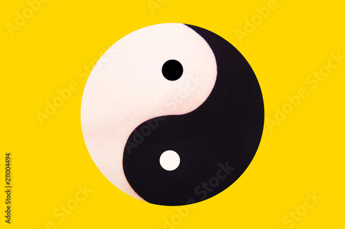 Ying yang symbol of harmony and balance on the yellow
