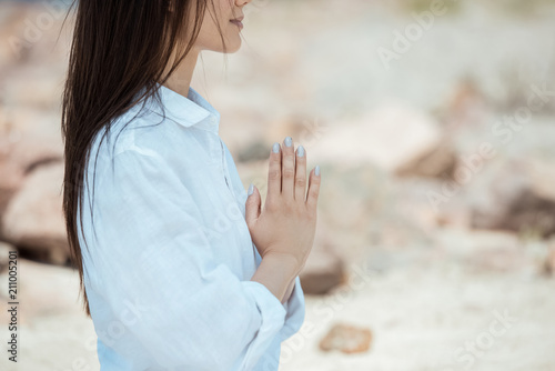 Portrait of a beautiful young woman sitting in a beautiful yoga