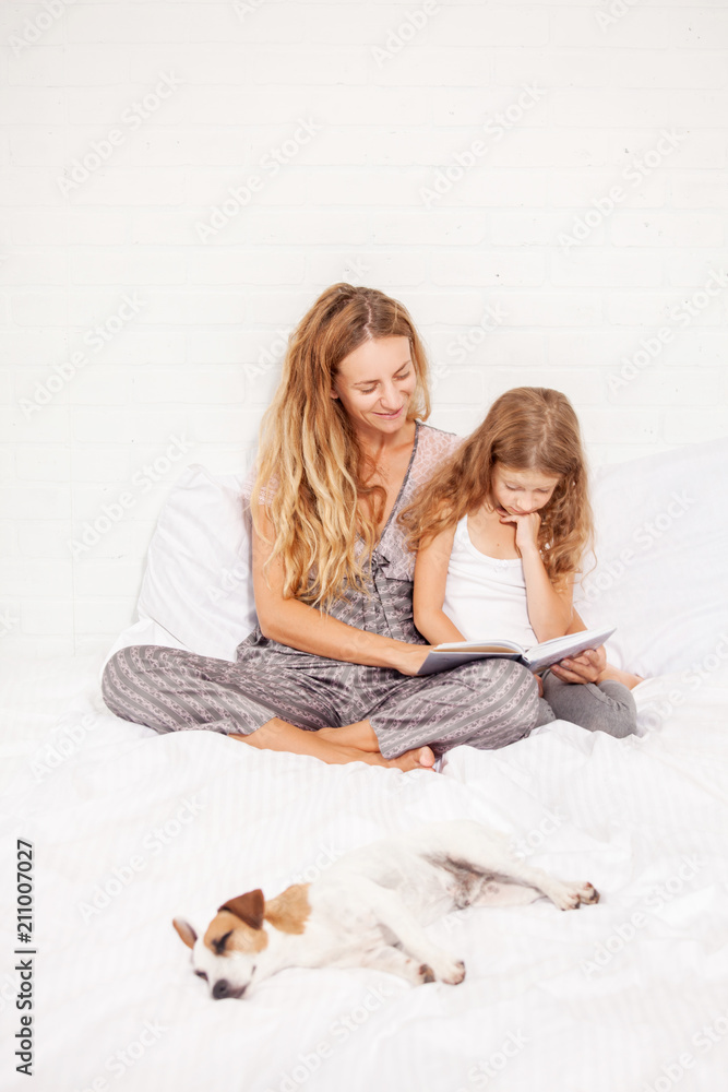 Woman with child reading book