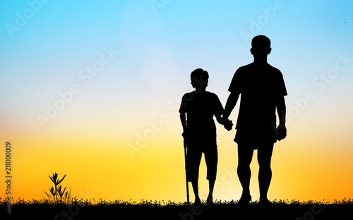  silhouette of the old man and son walk in the park    on blurry sunrise background.