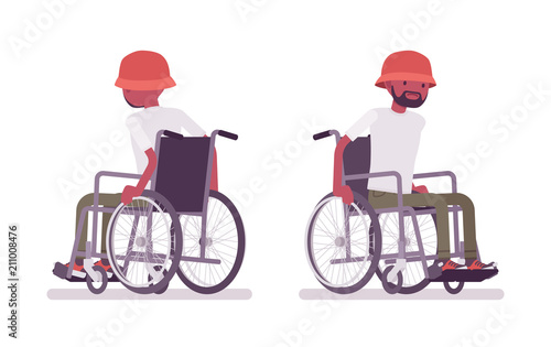 Male black young wheelchair user moving manual chair