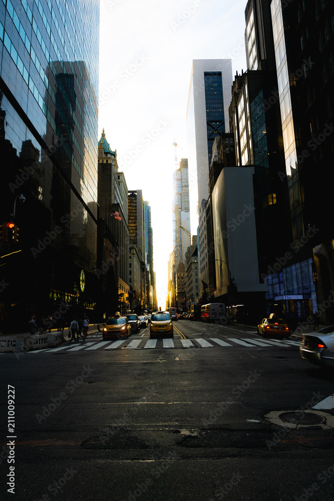 59th street in New York with the sun coming down the middle of the road during Manhattanhenge