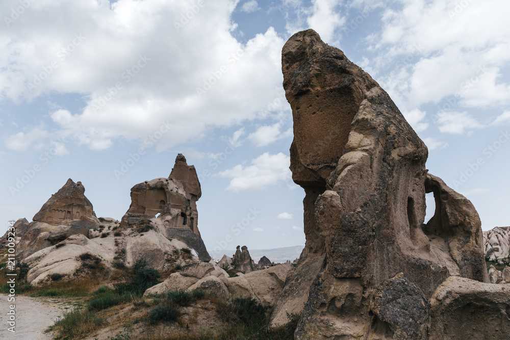 low angle view of bizarre rocks in goreme national park, cappadocia, turkey