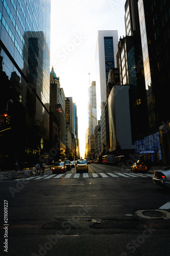 59th street in New York with the sun coming down the middle of the road during Manhattanhenge