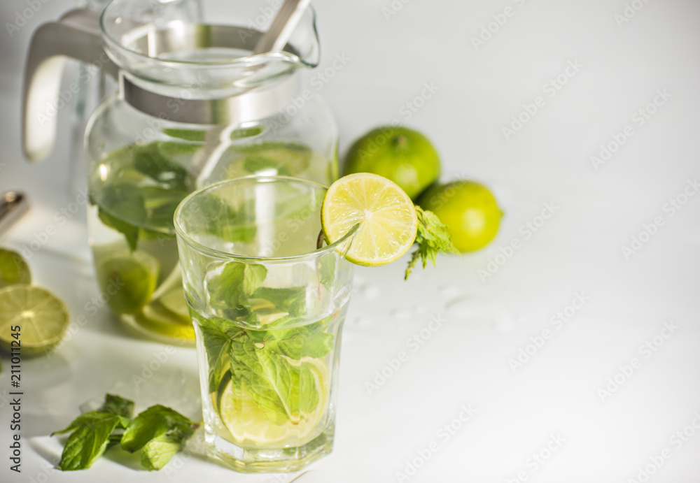 uice with lime and mint on white background uice with lime and mint on white background