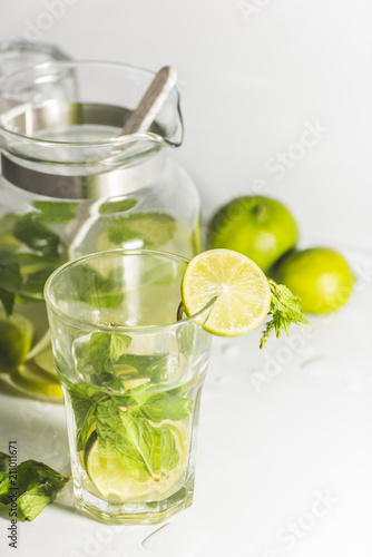 uice with lime and mint on white background