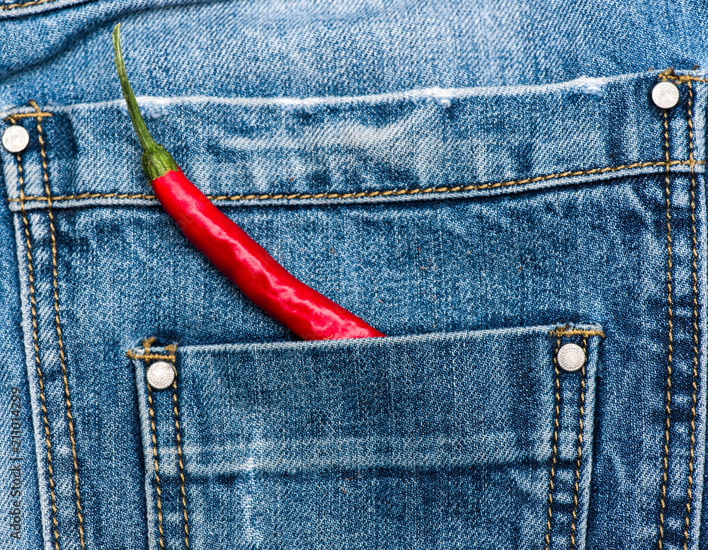 Pepper in back pocket of blue jeans. Pocket of jeans staffed with red  chilly pepper, denim background. Piquant secret in pocket of pants, top  view. Hot sensations concept Stock Photo | Adobe