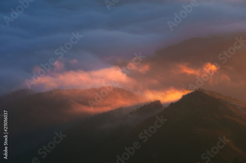 morning fog in the far mountains at sunrise © mimadeo