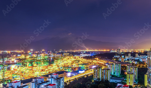 night cityscape view with logistic pier and mountain fuji background