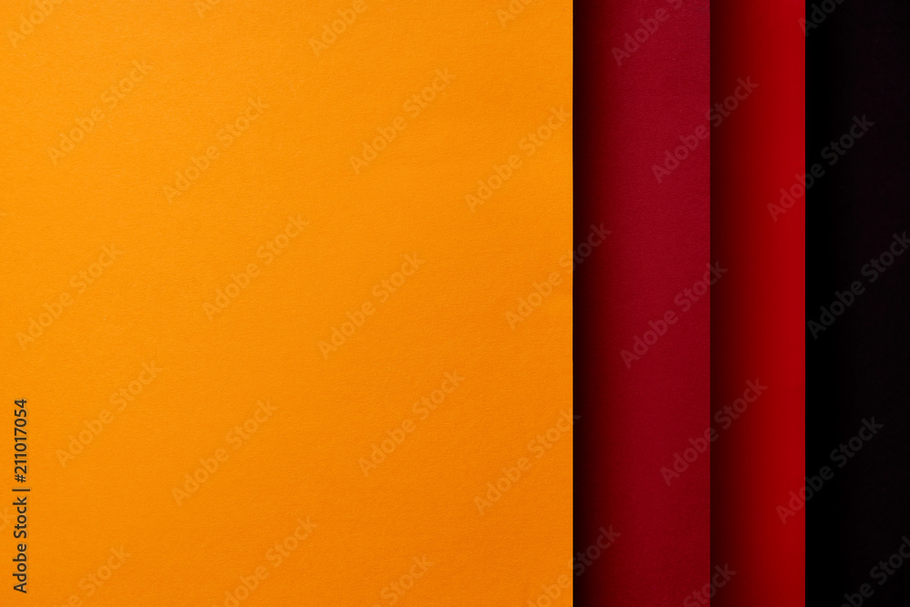 Paper sheets in red and yellow tones background