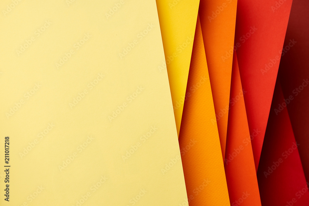 Pattern of overlapping paper sheets in red and yellow tones Stock Photo ...