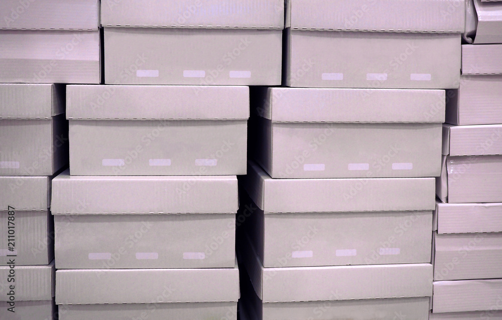 Row of shoes box stacked in store