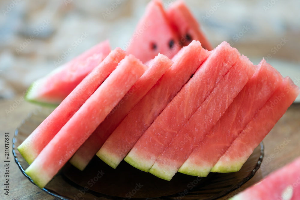 Slices of red watermelon seedless lie on a plate. Slices of red watermelon seedless lie on a plate.
