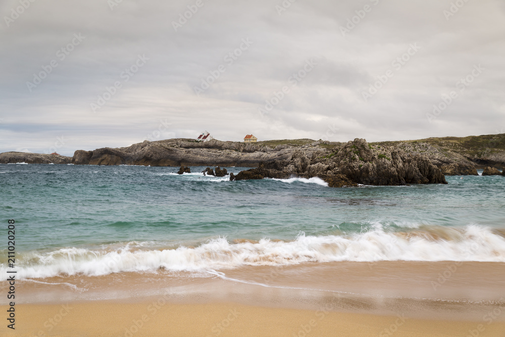 beautiful beach with waves breaking on the shore and without people
beautiful beach with waves breaking on the shore and without people