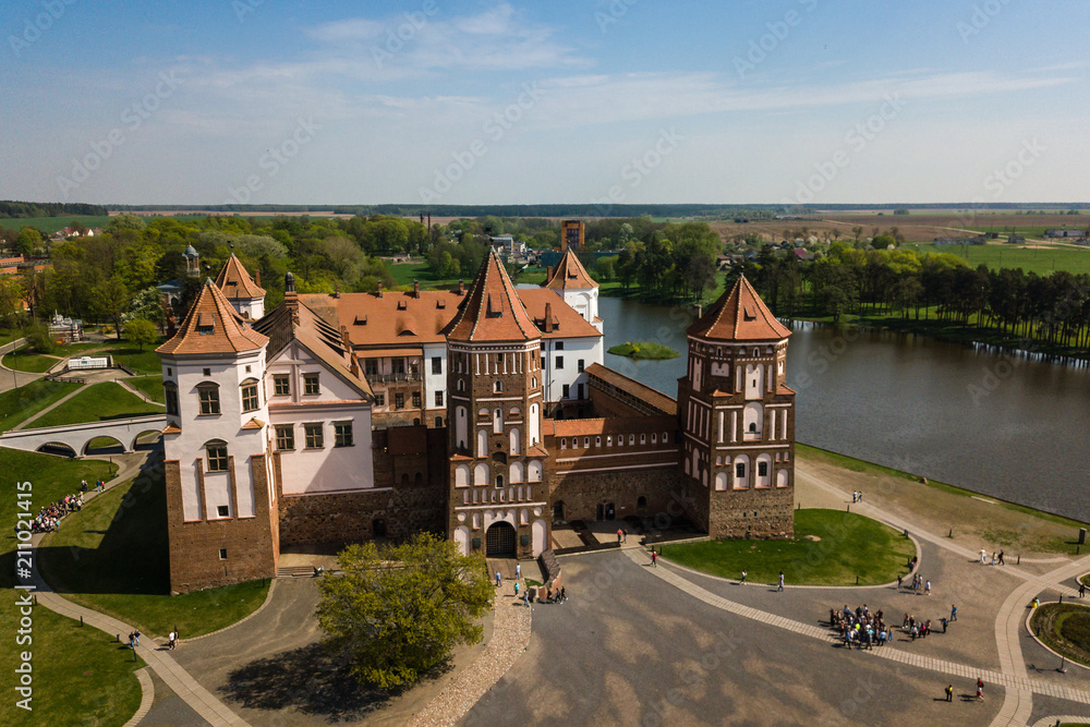 Beautiful aerial view of Medieval Mir castle complex on sunny sp