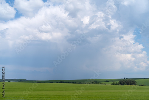 Podolia region, Ukraine. Landscape with dramatic clouds over agricultural field