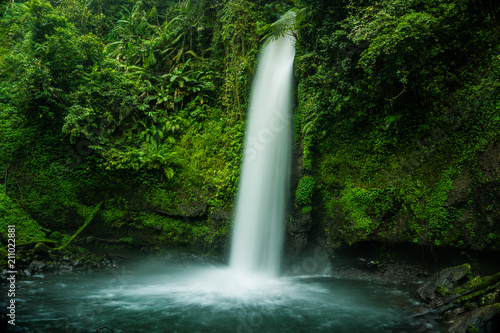 Waterfall in Tropical Rain Forest Jungle  Curug Sawer Situgunung Indonesia
