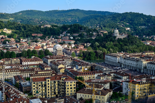 View of the whole of a city and its monuments as well as a backdrop mountains, review the San Marco square from the heights. Photograph taken in Turin, Italy.