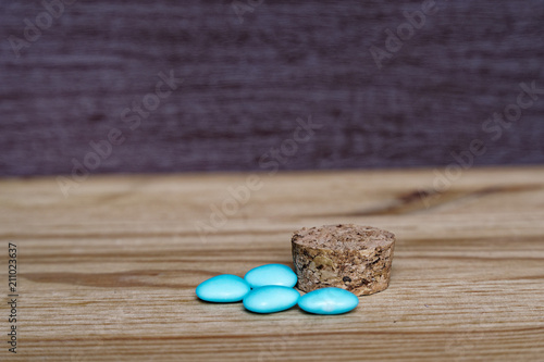 Pile of blue stones on wooden table, sample for postcard or greeting card