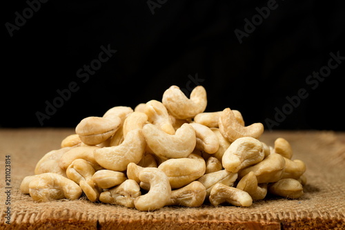 Pile of cashew nuts on sackcloth. photo