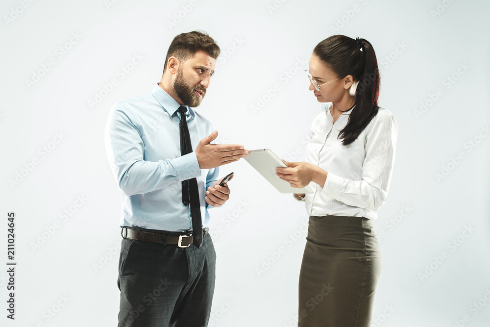 a business man shows the laptop to his colleague in the office. a business man shows the laptop to his colleague in the office.